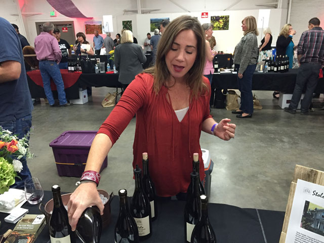 Maria Stolo Bennetti pours wine from her Stolo Family Vineyards in Cambria.